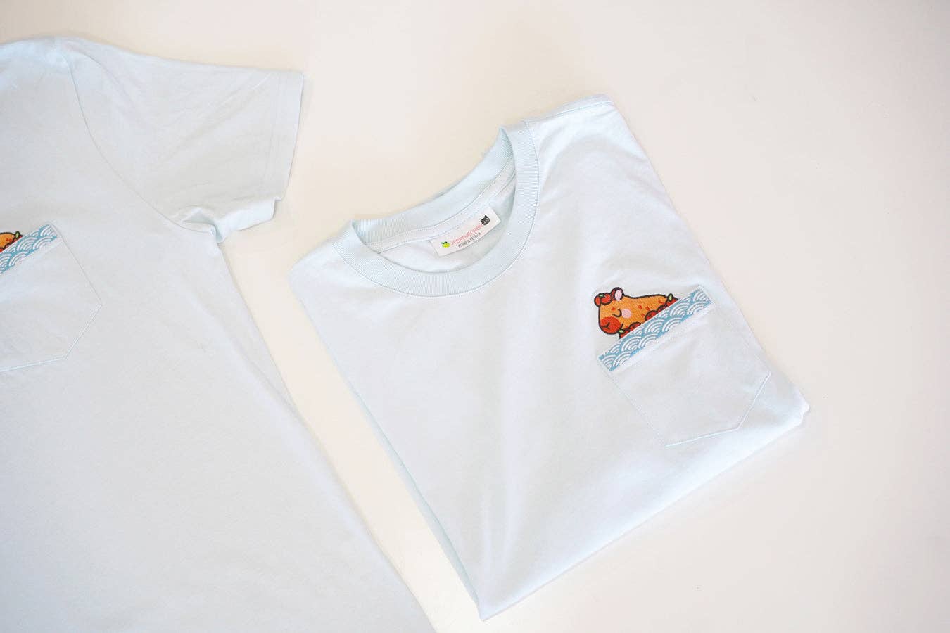 Jessthechen - Wholesale T-Shirt - Unisex - Bathing Capybara Embroidered Pocket Tee | Sky Blue2