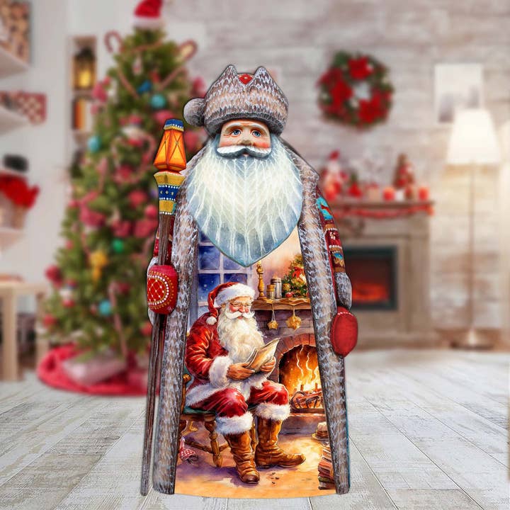 Fireside Magic List Santa Wood Carved Figurine by G.DeBrekht for wholesale by G.DeBrekht Artistic Studios