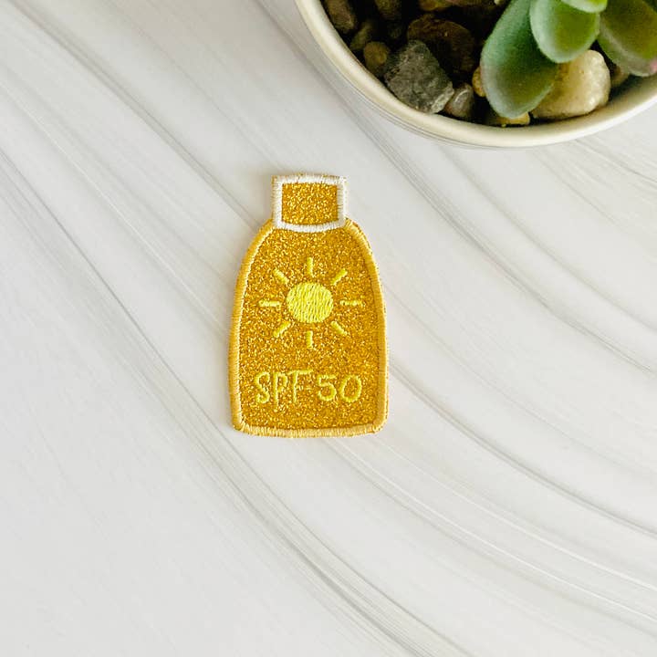 SPF 50 bottle glitter hat patch for wholesale by R & R Stitched