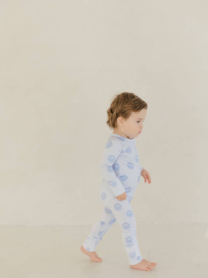 Blue Smiley | Bamboo Zipper Pajamas for wholesale by Baylor Moon