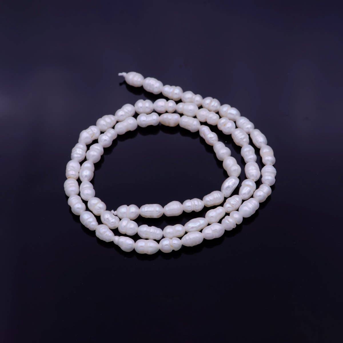 Aim Eternal - Wholesale Beads - AAA Natural Freshwater Pearl 5.8mm x 4mm Beads 61 Pieces per Strand | WA-1331 Clearance Pricing