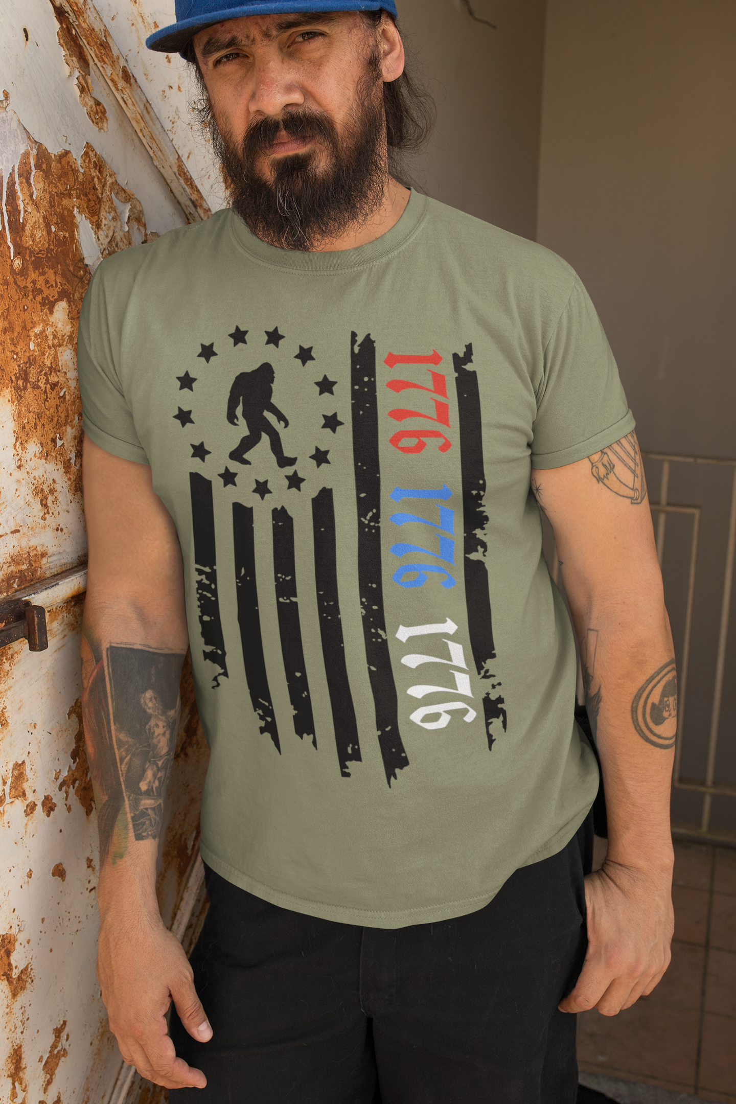 Squatchin’ Country - Wholesale T-Shirt (Graphic) - Unisex - Patriotic 1776 Bigfoot flag shirt - heather military green2