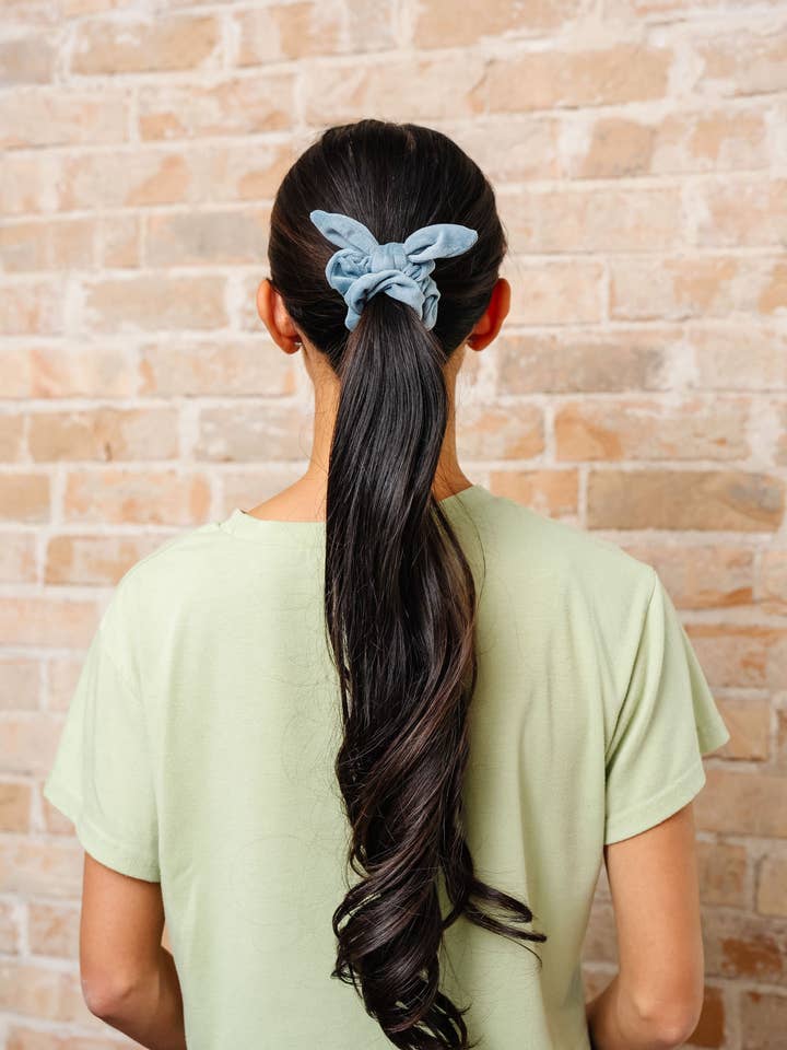 Dusty Blue Velvet Bow Scrunchie for wholesale by Shop Andi