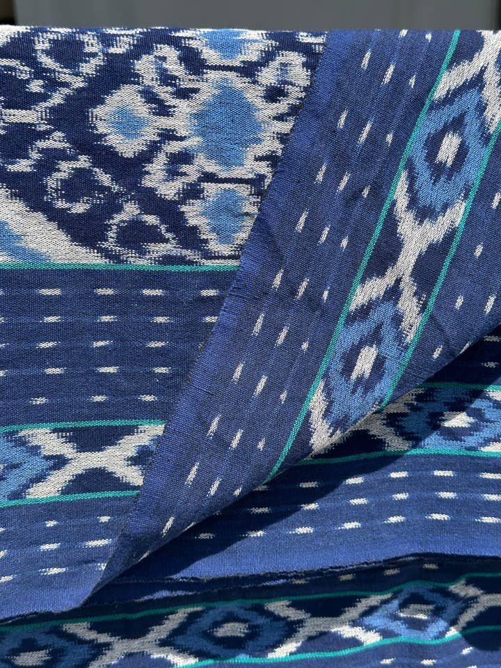 Large blue and white ikat with a border of small diamonds 2.35m x 1.15m for wholesale by Office Objets