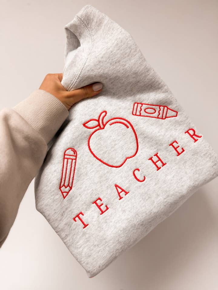 Besticktes Lehrer-Icons-Crewneck für den Großhandel von Johnson Livings LLC