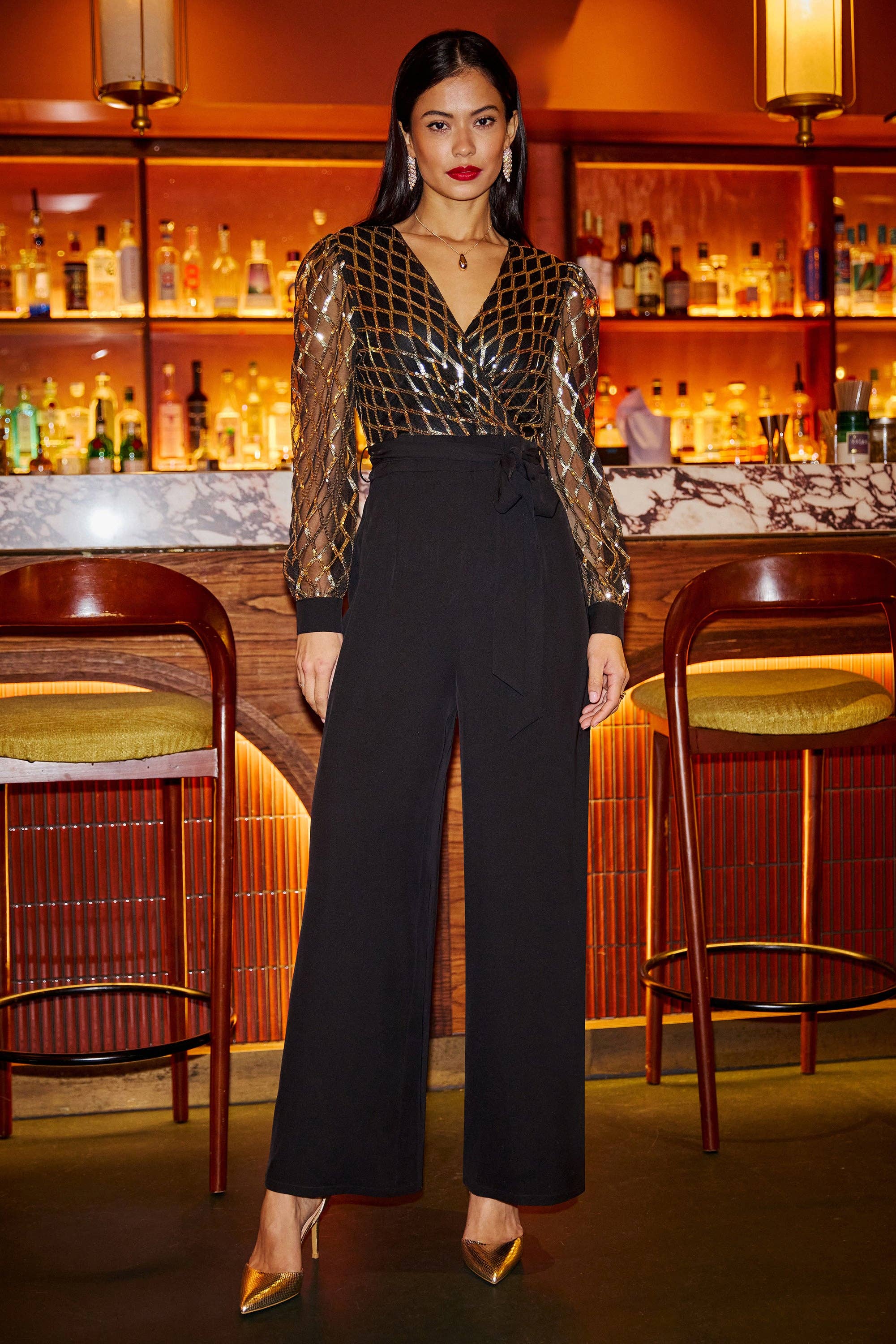 Yumi Black And Gold Sequin Wrap Over Jumpsuit for wholesale on Faire4