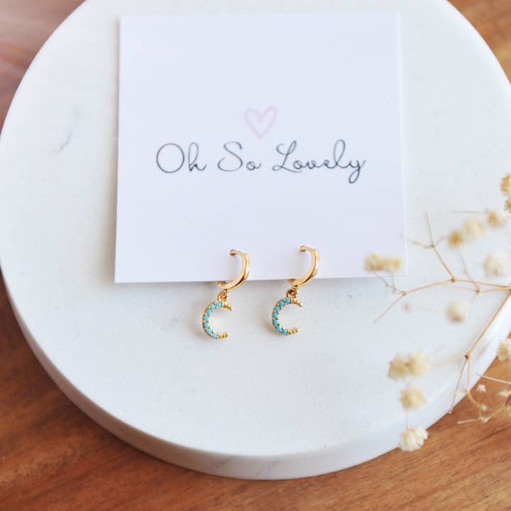 Crescent Moon Huggie hoop earrings for wholesale by Oh So Lovely