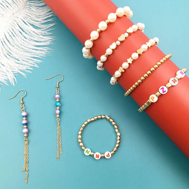 KLEUR Pearlescent Elegance: set met 15 rasters en 720 imitatieparels voor groothandel op Faire2