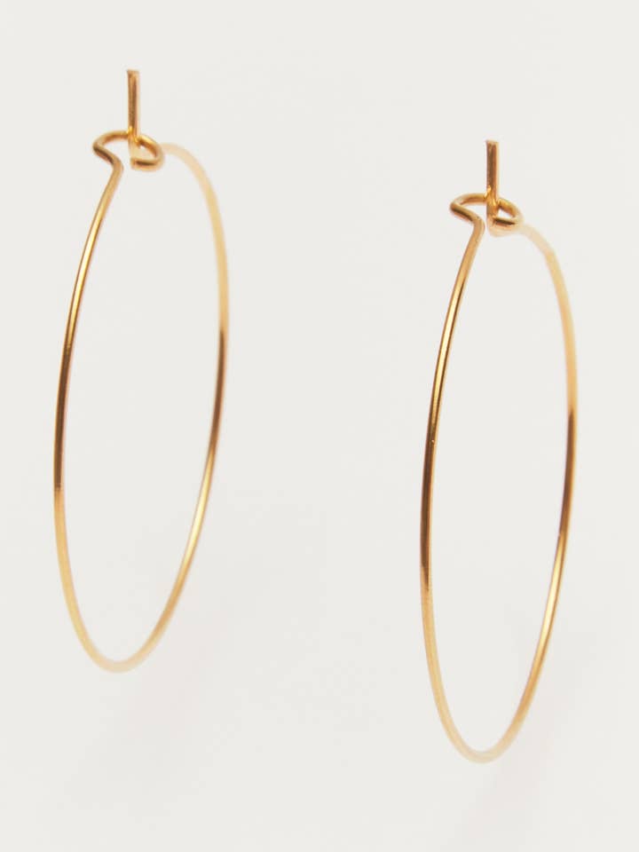 Maisie - large thin golden hoop earrings for wholesale by Palas