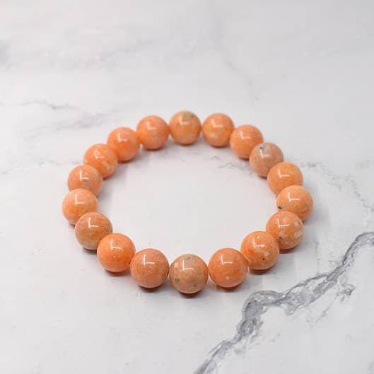 10mm orange calcite stone bracelet, handmade in Québec for wholesale by JorieJewelry