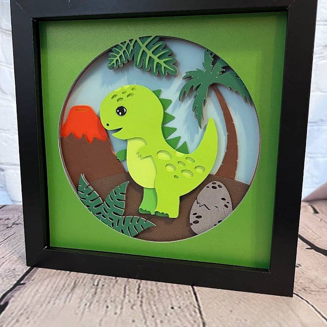 Olivia Reagan Designs - Vendita all'ingrosso Decorazione da parete 3D - Arte cartacea 3D dei cartoni animati T-Rex in una scatola d'ombra