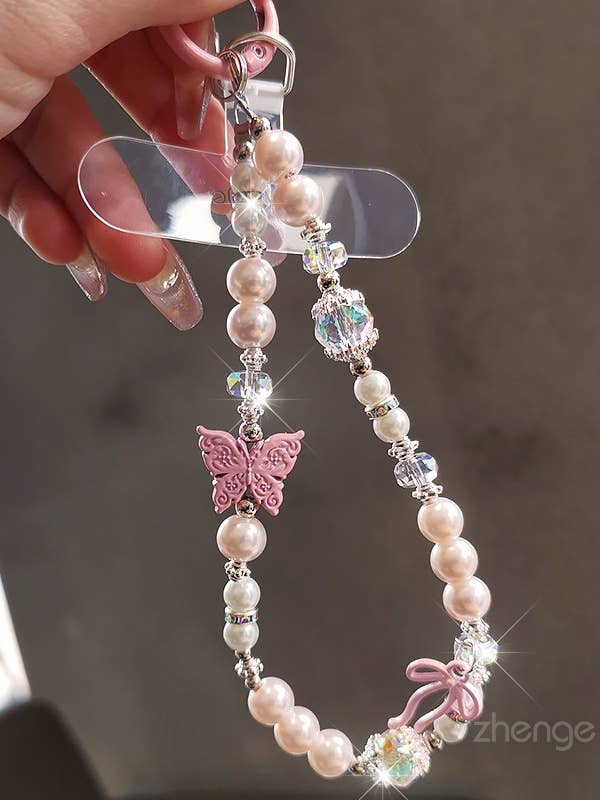KEYCHAIN PEARL CRYSTAL WRIST STRAP PHONE HOLDER for wholesale by DESHENG ENTERPRISE