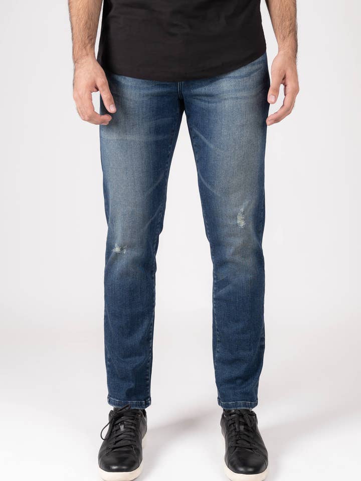 Slim fit jeans met donkere wassingen en lichte scheurtjes - Rotary voor wholesale door BRISK