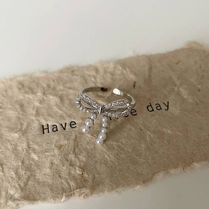 ACCITY - Wholesale Band/Stacked Ring - FASHIONABLE BOW SMALL PEARL RING FOR WOMEN_CWAJE3096