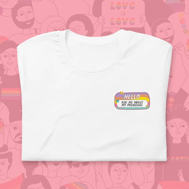 T-shirt Hello Ask Me About My Pronons | Camicia LGBTQIA+ per la vendita all'ingrosso da parte di a riley creations