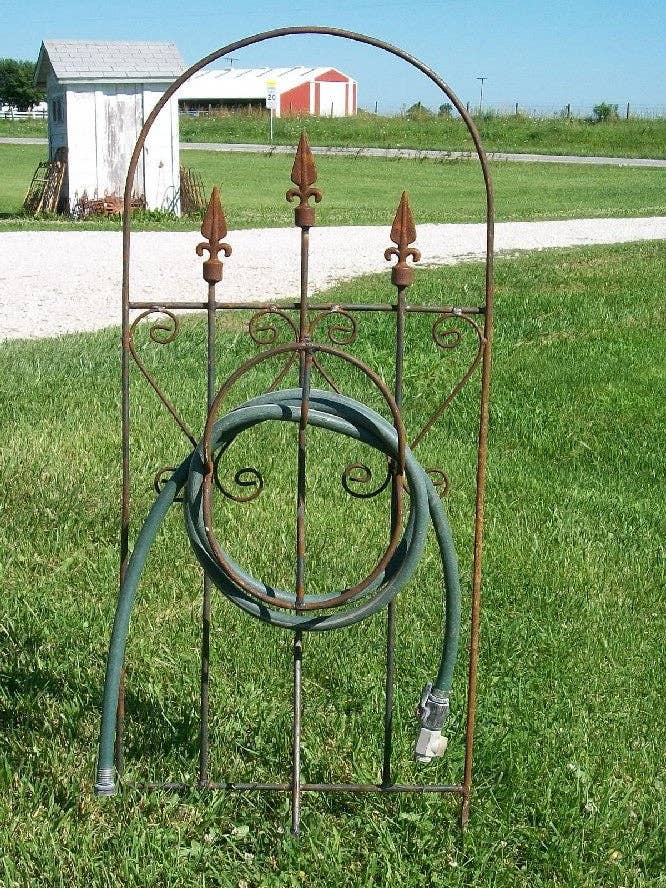 Iron Hose Wheel with 3 Finials & Stakes into the Ground for wholesale by Garden Iron And More