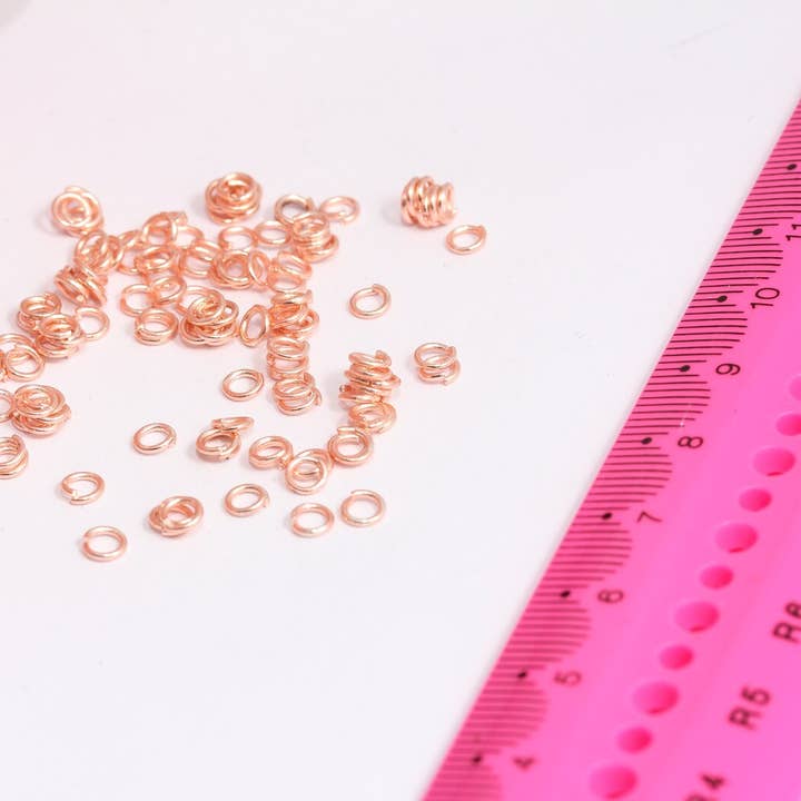 22 Ga 4mm Rosaguldbelagte Åbne Springringe, ROSE618 for engroshandel hos QueenJewelryM