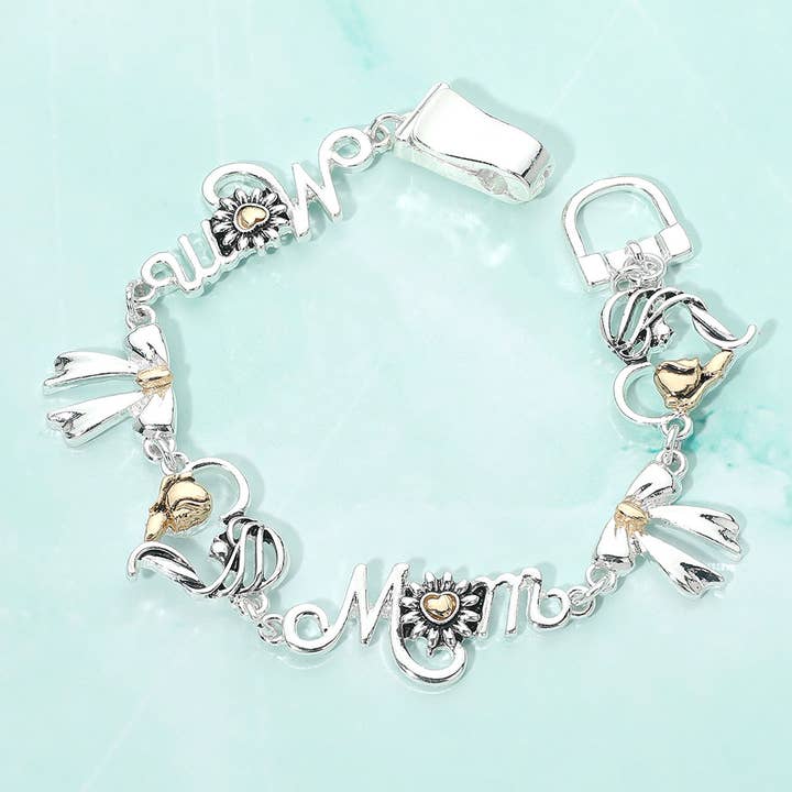 Bracciale magnetico a maglie con ciondolo a forma di cuore di mamma in metallo bicolore con fiocco. per la vendita all'ingrosso da parte di Sensibling Corp.