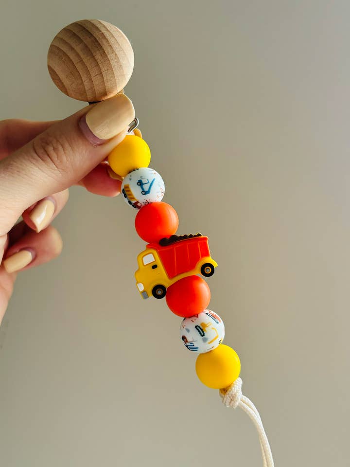 Dump Truck Paci Teething Clip for wholesale by Clip and Coast