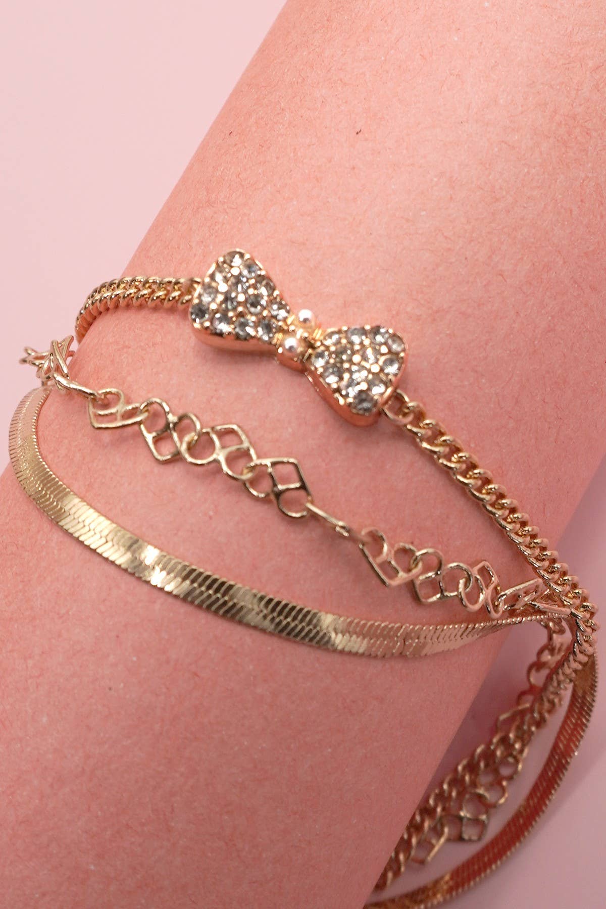 Gold MULTI LAYER BOW CHARM BRACELET | 80B268 for wholesale on Faire2