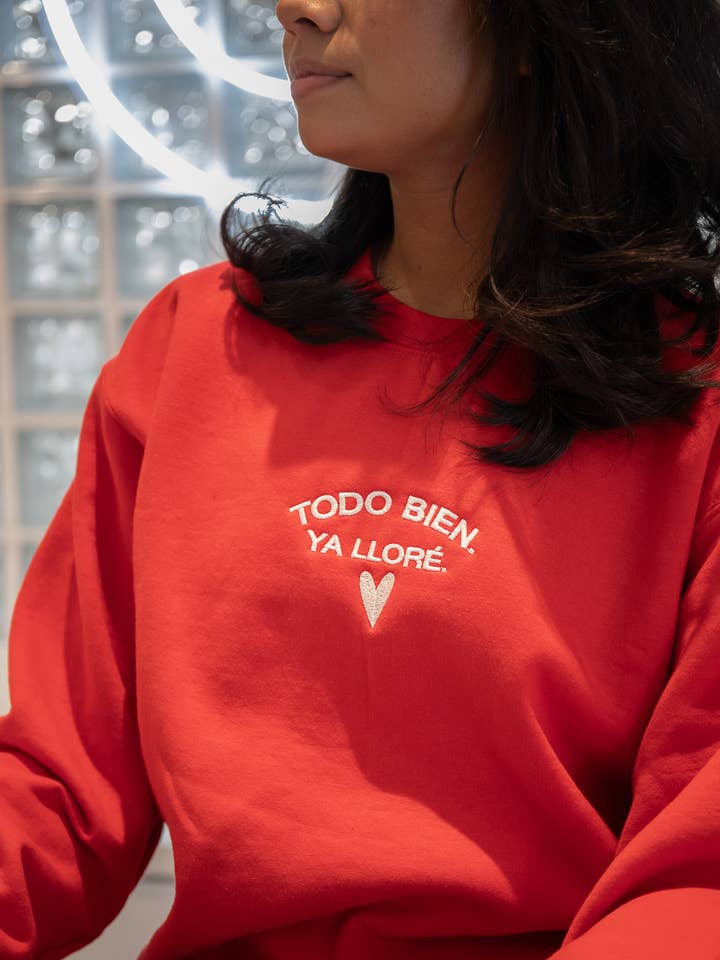 Limited Edition Todo Bien Ya Llore Sweatshirt (Red) for wholesale by Jen Zeano Designs