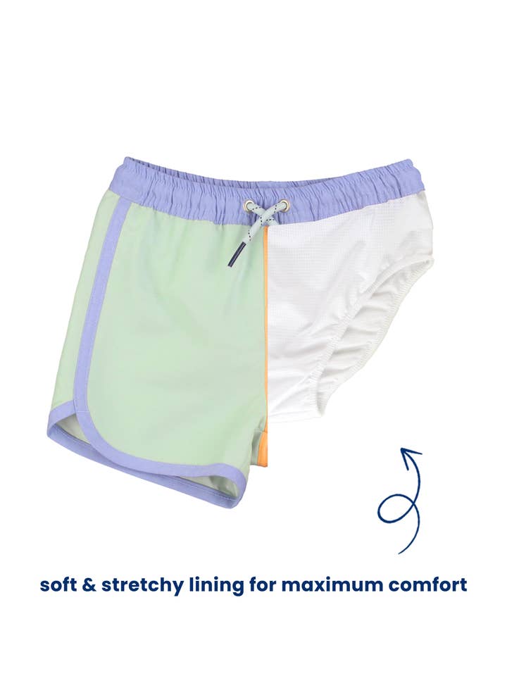 Multicolore Costume da bagno con orlo a delfino a blocchi di colore per ragazzi in pervinca, verde ghiaccio e zenzero. in vendita all'ingrosso su Faire5