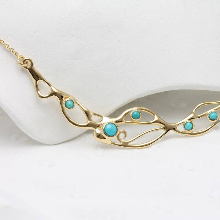 Collana Statement in Oro con Turchese Americano per la vendita all'ingrosso da parte di Banyan Jewellery