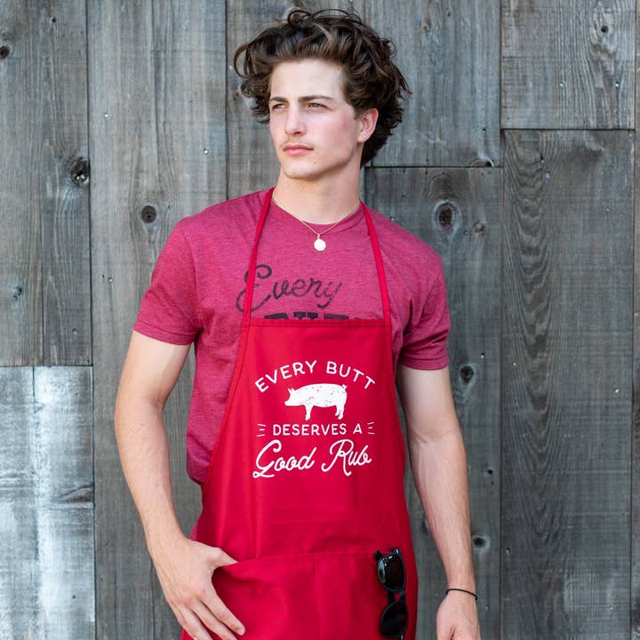 Red Every Butt Deserves a Good Rub Apron for wholesale on Faire1