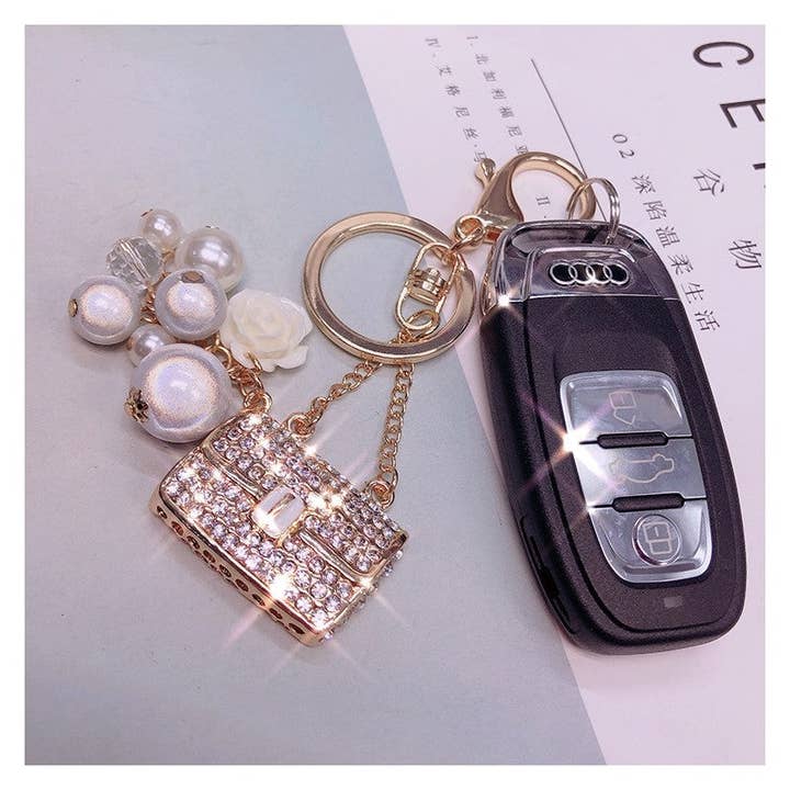 1 Colgante de llavero con forma de bolsa de diamantes creativos con cuentas de venta al por mayor en Faire1