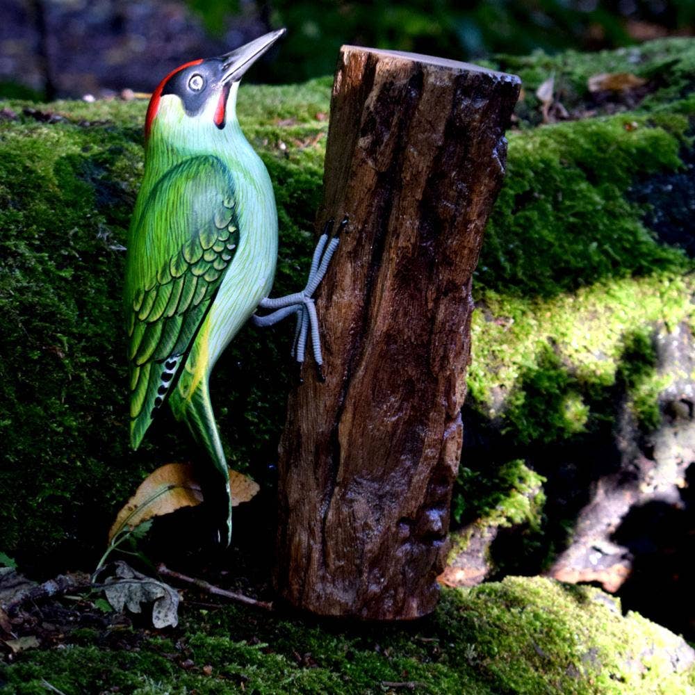 Shared Earth – wholesale Decorative figurine – Green woodpecker on tree trunk, hand carved and painted1