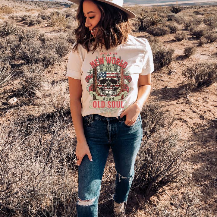 LIVING IN A NEW WORLD WITH AN OLD SOUL SKULL VINTAGE GRAPHIC for wholesale by Haverly and Co.