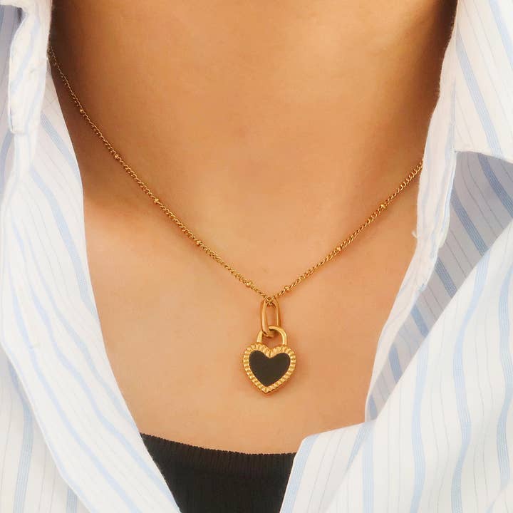 Kylie Non-Tarnish Double-Sided Black & White Heart Necklace for wholesale on Faire