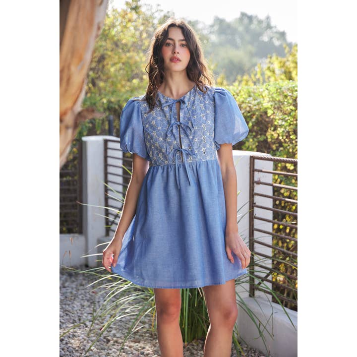 CHAMBRAY EYELET BUST MINI DRESS WITH FRONT BOW TIE DETAIL for wholesale on Faire