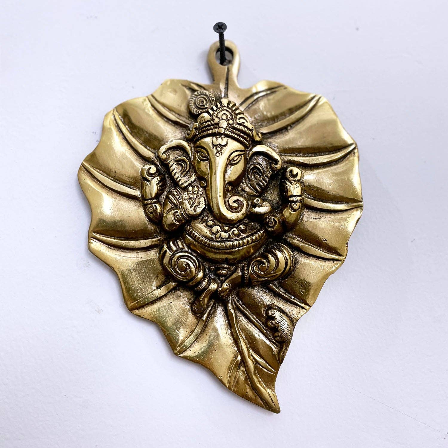 Golden Brass Ganesha Wall Hanging on Antique Peepal Leaf|Ganpati Idol for Home Decor & Diwali| Ganesh Hanging Decor For Good Luck for wholesale on Faire0