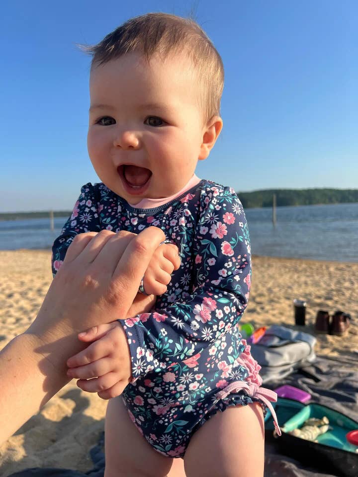 RuffleButts + RuggedButts - Wholesale Rashguard - Baby - Baby Girls Moonlit Meadow Long Sleeve One Piece Rash Guard Swimsuit with Signature Rear Ruffles
1