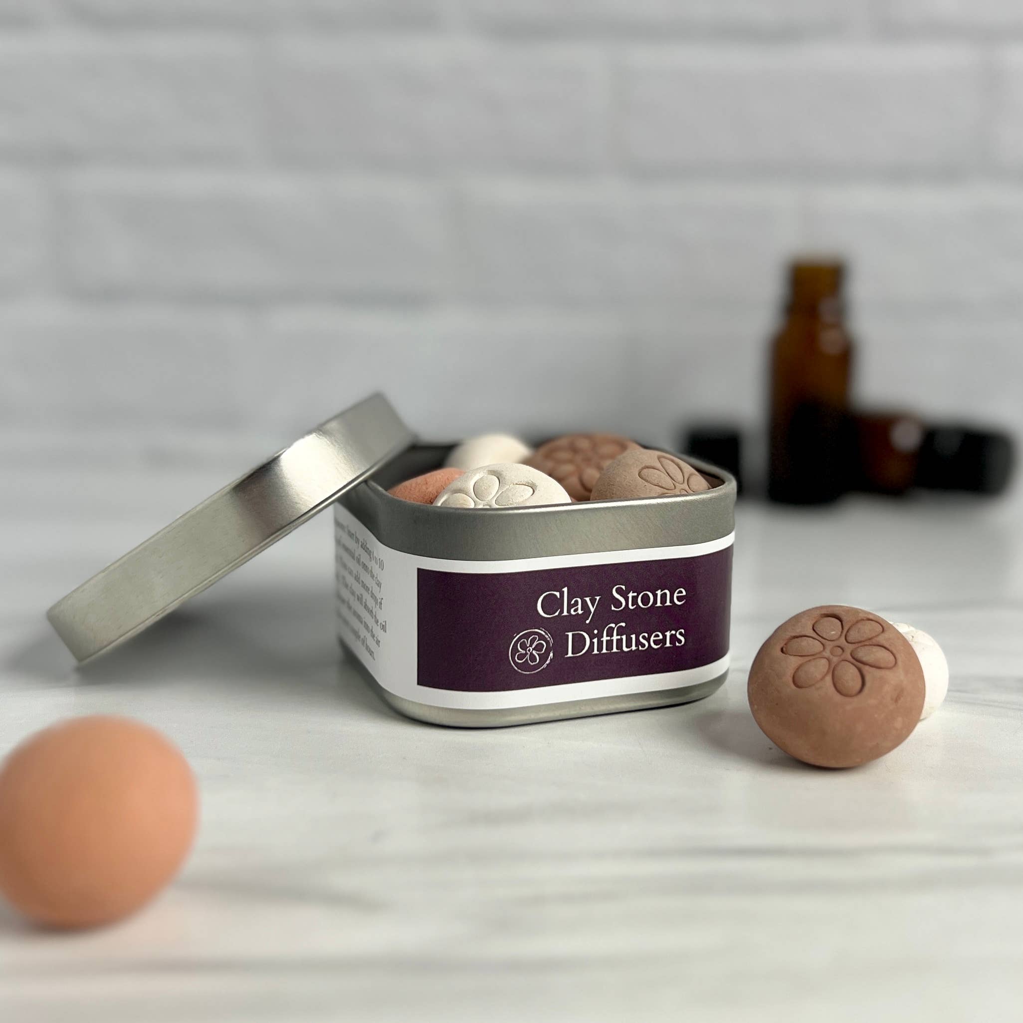 Blooming Light Botanical Alchemy, llc - Wholesale Reed Diffuser - Clay Diffusing Stones Tin5