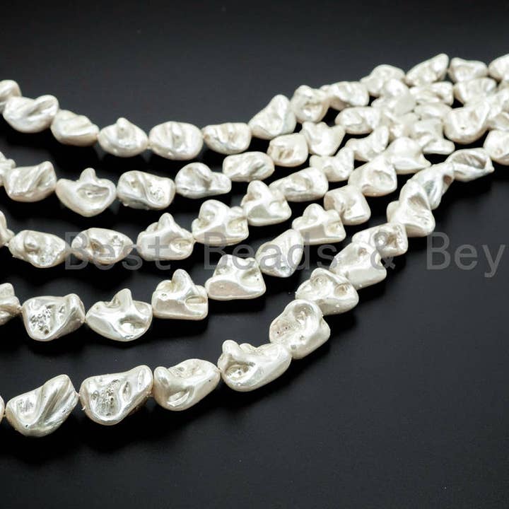 Quality Natural Mother of Pearl beads, 15-21mm, White Irregular Plated Pearl Shell Beads, 16inch strand, SKU#T109 and other Purchase Wholesale oyster shells for crafts. Free Returns & Net 60 Terms on Faire trending on Faire.