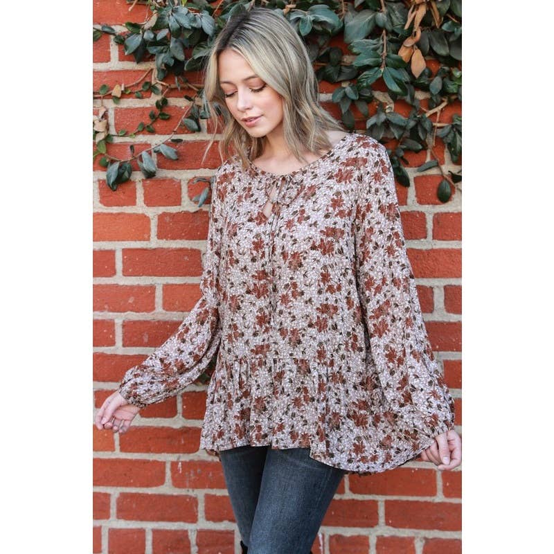 Moka Top con maniche a sbuffo con peplo floreale in vendita all'ingrosso su Faire2