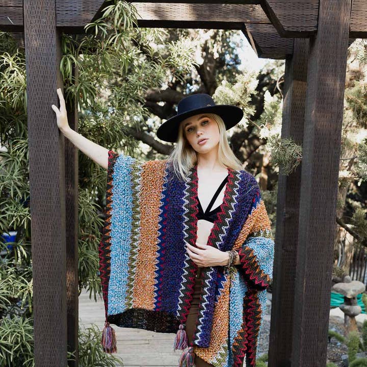 Unique Patterned Crochet Ruana – Colorful Tassel Cardigan ❤️ and other Purchase Wholesale crochet poncho yarn. Free Returns & Net 60 Terms on Faire trending on Faire.