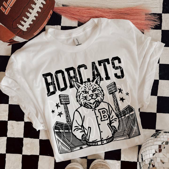 Bobcats Letterman Mascot T-Shirt | Trendy School Spirit Shirt | Fast Shipping | Super Soft Shirts for Men/Women/Kid's for wholesale by Red Dirt Transfers