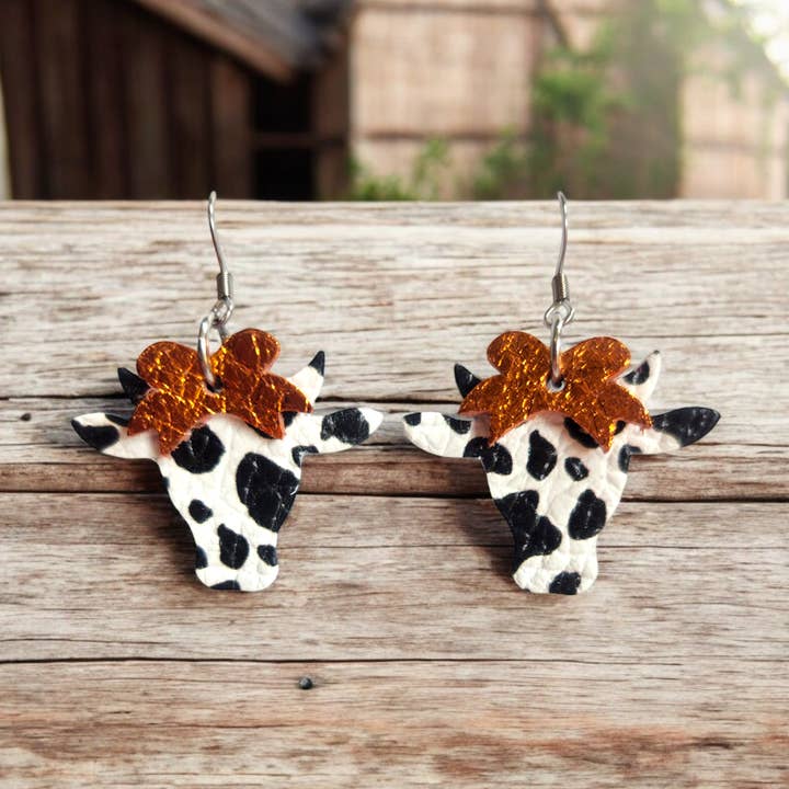 Black and white Cows with Orange Bows for wholesale by Bushleys Beauties, LLC