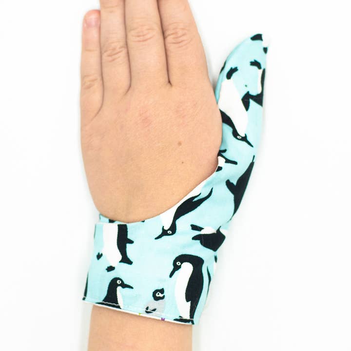 Thumbsie® Penguin thumb guard for wholesale by Thumbsie Ltd