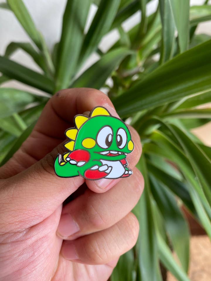 Cute Bubble Bobble Dino Hard Enamel Pin for wholesale by Hype Pins