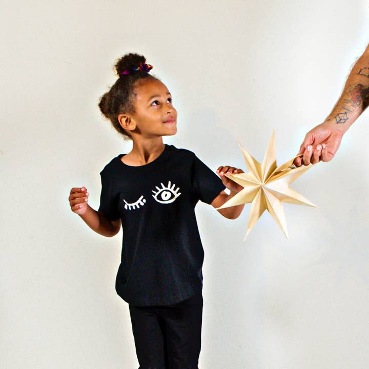 Wink Children's Tee (Black) for wholesale by Origin Africa