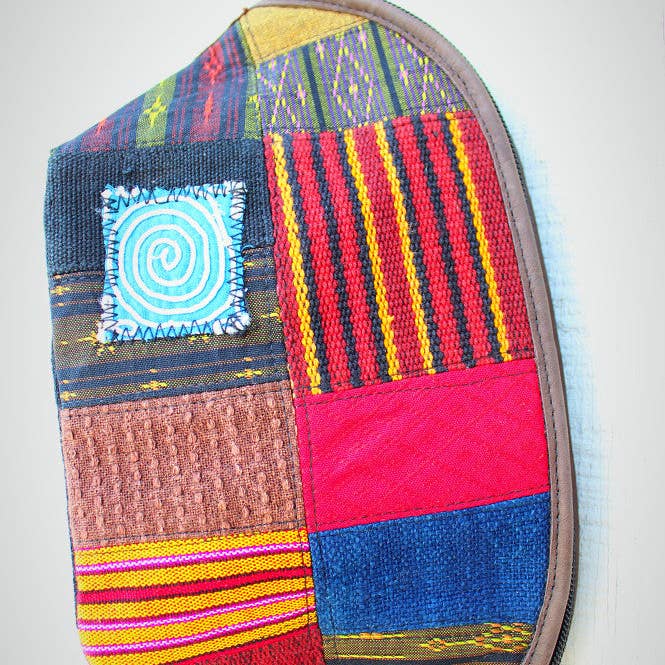 Handmade hill tribe artisan handwoven cotton patchwork with leather accent wristlet / clutch for wholesale by Atlas Goods By Your Needs Company