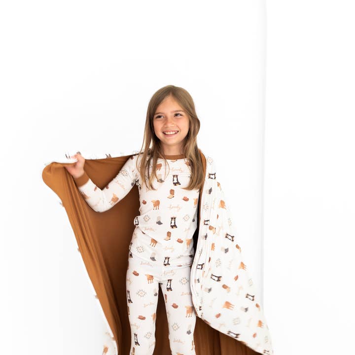 Bedtime Buckaroo Huggable Blanket and other Purchase Wholesale huggalugs. Free Returns & Net 60 Terms on Faire trending on Faire.