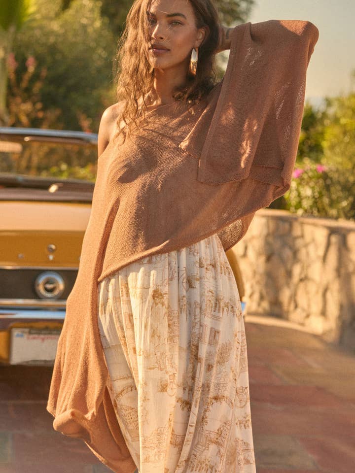 Poncho en maille légère et transparente court pour la vente par Promesa USA