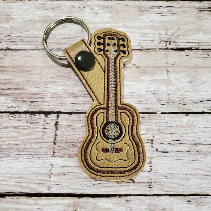 Tan Vinyl Embroidered Guitar Key Chain Snap Tab for wholesale by Deckard Designs, LLC