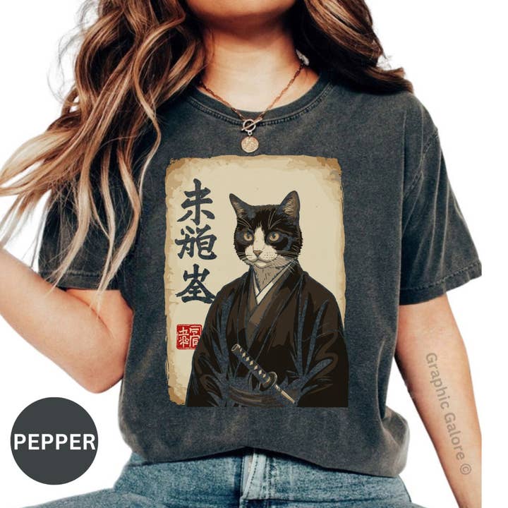 Samurai Cat T-Shirt, Japanese Art Tee, Warrior Kitten Design, Cool Cat Shirt, Unique Gift for Cat Lovers, Anime Style Clothing for wholesale by Graphic Galore