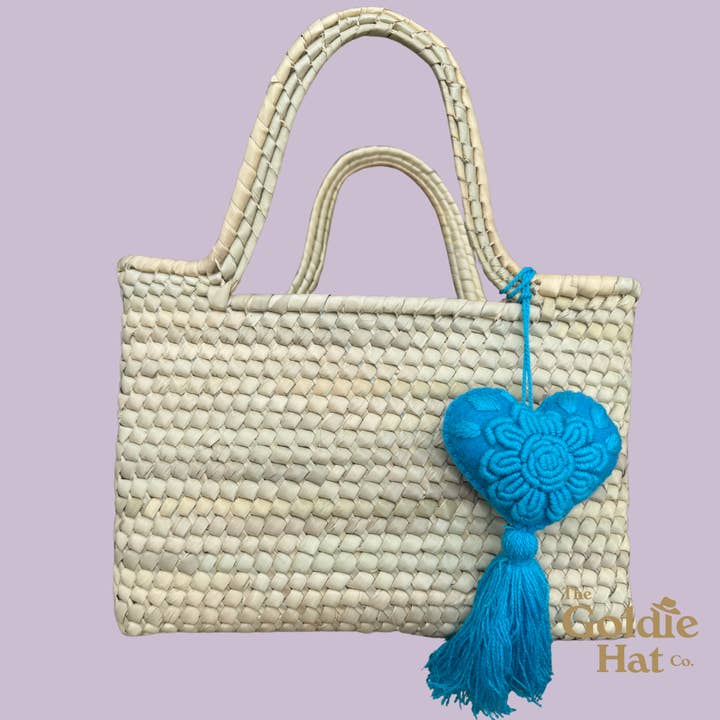 Blue Heart Pom for wholesale by The Goldie Hat Co